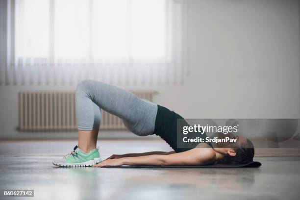 tight curves workout - women lying imagens e fotografias de stock