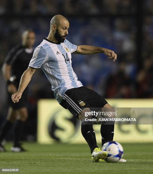 Argentina's defender Javier Mascherano kicks the ball during the 2018 FIFA World Cup South American qualifier football match against Peru at the...