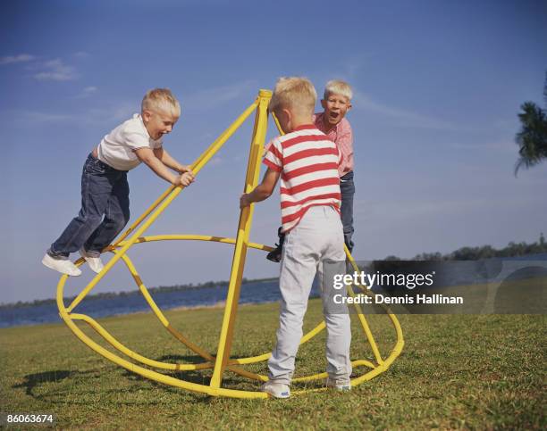 Boys Having Fun on Playground Equipment