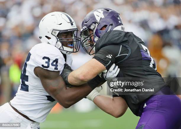 Shane Simmons of the Penn State Nittany Lions rushes against Blake Hance of the Northwestern Wildcats at Ryan Field on October 7, 2017 in Evanston,...