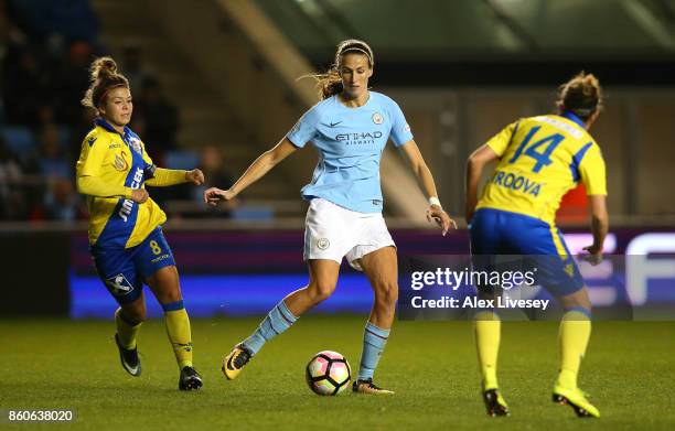 Jill Scott of Manchester City Ladies beats Nadine Prohaska of St. Polten Ladies during the UEFA Women's Champions League match between Manchester...