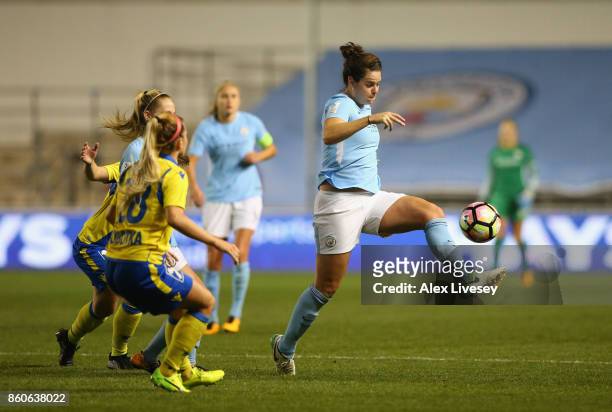 Jennifer Beattie of Manchester City Ladies passes the ball under pressure from Sandrine Sobotka of St. Polten Ladies during the UEFA Women's...