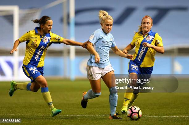 Izzy Christiansen of Manchester City Ladies beats Fanni Vago of St. Polten Ladies during the UEFA Women's Champions League match between Manchester...