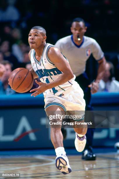 Muggsy Bogues of the Charlotte Hornets passes the ball circa 1994 at the Charlotte Coliseum in Charlotte, North Carolina. NOTE TO USER: User...