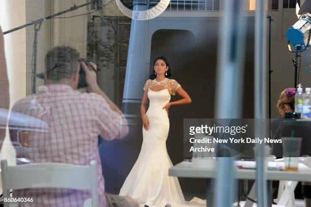 Ambra Battilana Gutierrez models a wedding dress at a midtown photo shoot on Tuesday, October 10, 2017.