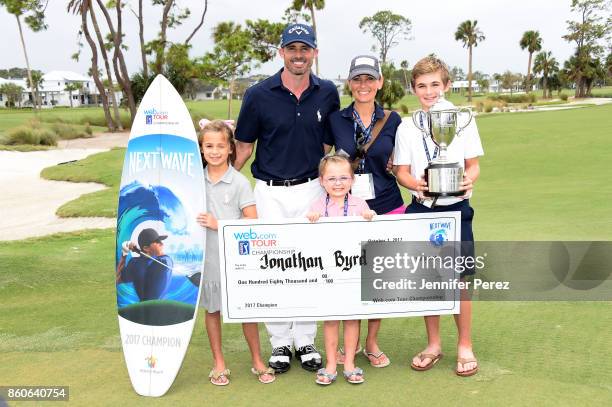 Jonathan Byrd poses with his family and prizes after the final round of the Web.com Tour Championship at Atlantic Beach Country Club on October 2,...