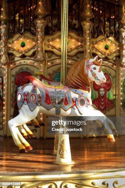 vintage horse carousel or merry go round - karusell stock-fotos und bilder