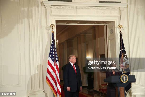 White House Deputy Chief of Staff Kirstjen Nielsen speaks as U.S. President Donald Trump listens during a nomination announcement at the East Room of...