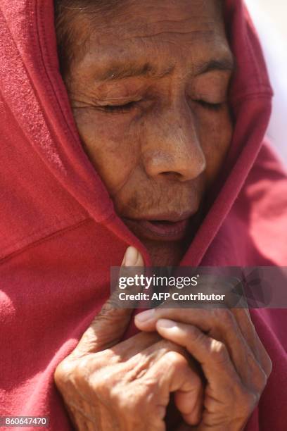 Nahua Pipil indigenous woman participates in a ceremony commemorating the International Day of Indigenous Resistance at the Salvador del Mundo square...