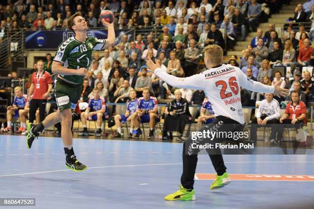 Hans Lindberg of Fuechse Berlin and Michael Hassferter of HC Erlangen during the game between Fuechse Berlin and the HC Erlangen on S2eptember 12,...