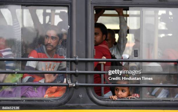 Rush in the DTC bus after increased Delhi Metro fare at ITO on October 12, 2017 in New Delhi, India.