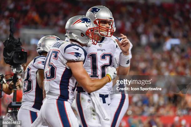 New England Patriots wide receiver Chris Hogan celebrates his touchdown reception with New England Patriots quarterback Tom Brady during an NFL...