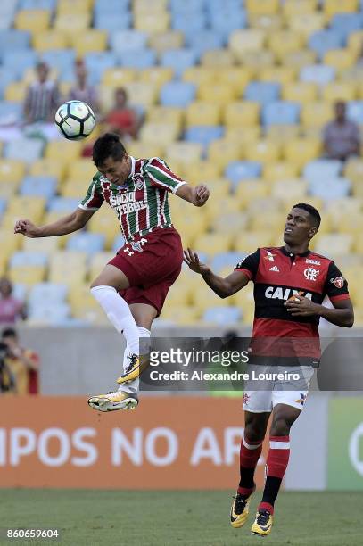 Orlando Berrao of Flamengo battles for the ball with Douglas of Fluminense during the match between Flamengo and Fluminense as part of Brasileirao...