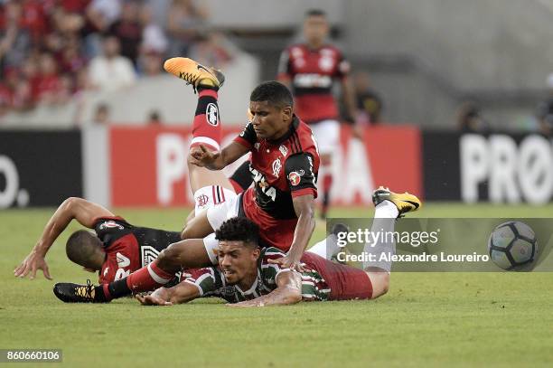 Marcio Araujo of Flamengo battles for the ball with Douglas of Fluminense during the match between Flamengo and Fluminense as part of Brasileirao...