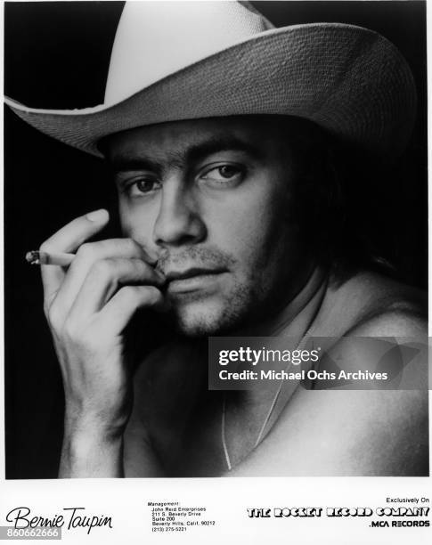 Songwriter Bernie Taupin poses for a portrait in March 1977.