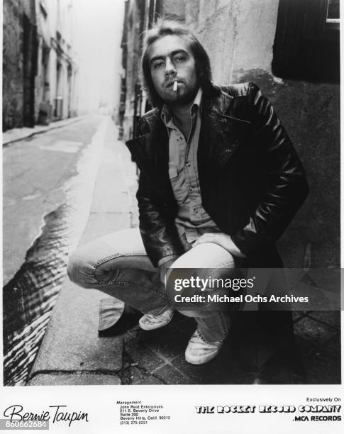 Songwriter Bernie Taupin poses for a portrait in March 1977.