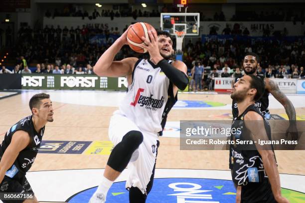Alessandro Gentile of Segafredo competes with Diego Flaccadori and Yannick Franke and Chane Behanan of Dolomiti Energia during the LBA LegaBasket...