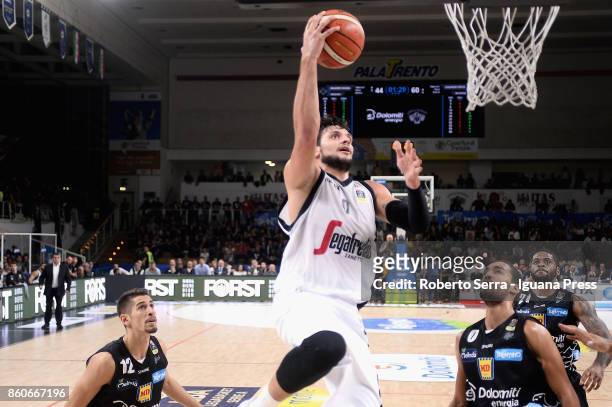 Alessandro Gentile of Segafredo competes with Diego Flaccadori and Yannick Franke and Chane Behanan of Dolomiti Energia during the LBA LegaBasket...