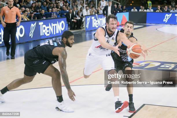 Guido Rosselli of Segafredo competes with Chane Behanan and Diego Flaccadori of Dolomiti Energia during the LBA LegaBasket match between Virtus...