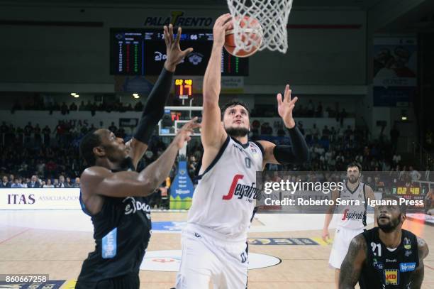 Alessandro Gentile of Segafredo competes with Dominique Sutton and Chane Behanan of Dolomiti Energia during the LBA LegaBasket match between Virtus...