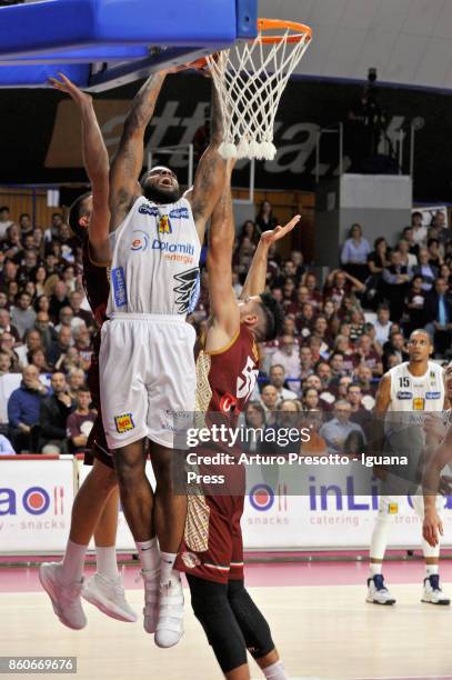 Chane Behanan of Dolomiti Energia competes with Michael Bramos and Mitchell Watt of Umana during the LBA LegaBasket of Serie A1 match between Reyer...