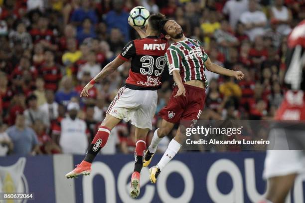 Lucas PaquetÃ¡ of Flamengo battles for the ball with Gustavo Scarpa of Fluminense during the match between Flamengo and Fluminense as part of...