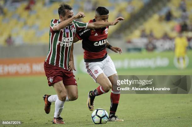 Everton of Flamengo battles for the ball with Lucas of Fluminense during the match between Flamengo and Fluminense as part of Brasileirao Series A...
