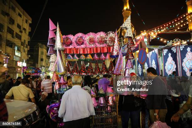 People are shopping as they attend the birthday celebrations of the founder of the Badawiyyah Sufi order Ahmad al-Badawi at Seyyid Al-Badawi Mosque...