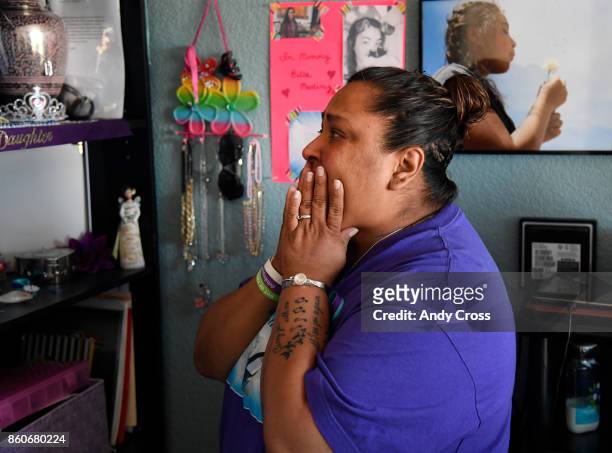 Melissa Martinez fights back tears looking at a shrine for her daughter Isabella, in Isabella's room October 12, 2017. Isabella Martinez committed...