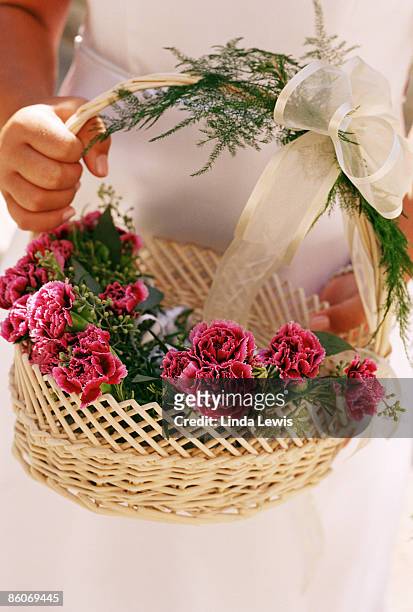 flower girl holding basket - asparagina foto e immagini stock