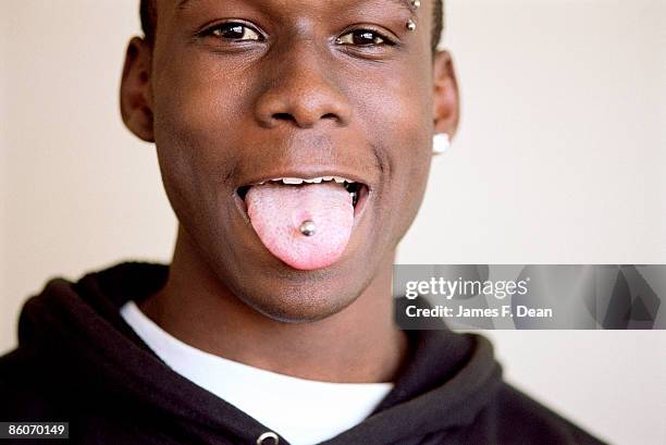 man showing pierced tongue - james pierce stock pictures, royalty-free photos & images