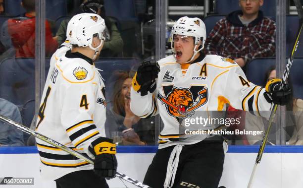 Maxime Comtois of the Victoriaville Tigres celebrates his goal with his teammate Jerome Gravel against the Quebec Remparts during the second period...