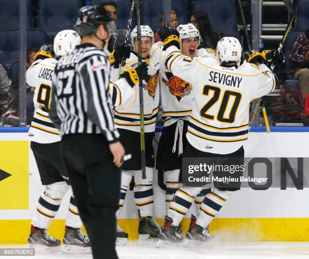 Maxime Comtois of the Victoriaville Tigres celebrates his goal with his teammates Mathieu Sevigny, Pascal Laberge and Jerome Gravel against the...