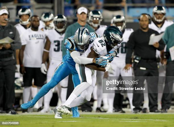 Torrey Smith of the Philadelphia Eagles runs the ball against Daryl Worley of the Carolina Panthers in the first quarter during their game at Bank of...