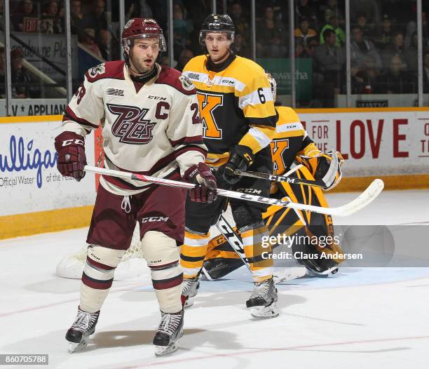 Jacob Paquette of the Kingston Frontenacs watches Logan DeNoble of the Peterborough Petes in an OHL game at the Peterborough Memorial Centre on...
