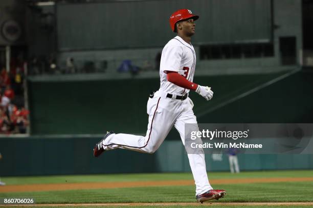 Michael A. Taylor of the Washington Nationals rounds the bases after hitting a three run home run against the Chicago Cubs during the second inning...