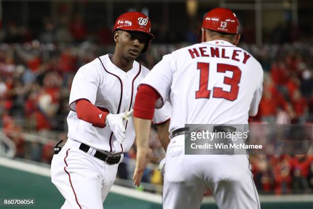 Michael A. Taylor of the Washington Nationals celebrates with Bob Henley of the Washington Nationals after hitting a three run home run against the...
