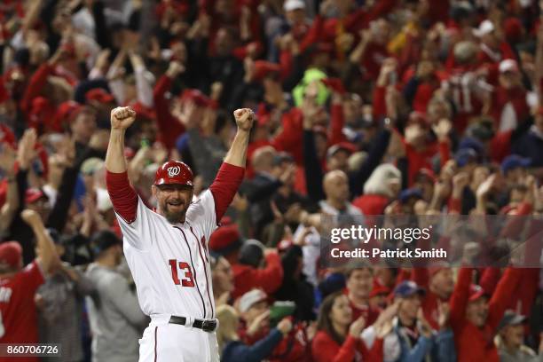 Bob Henley of the Washington Nationals reacts after Michael Taylor of the Washington Nationals hit a three run home run against the Chicago Cubs...