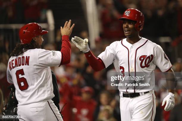 Michael A. Taylor of the Washington Nationals celebrates with Anthony Rendon of the Washington Nationals after hitting a three run home run against...