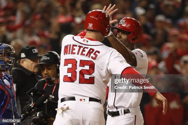 Michael A. Taylor of the Washington Nationals celebrates with Matt Wieters of the Washington Nationals after hitting a three run home run against the...