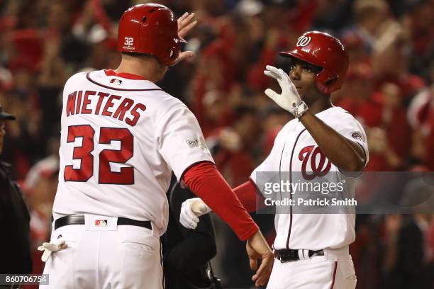Michael A. Taylor of the Washington Nationals celebrates with Matt Wieters of the Washington Nationals after hitting a three run home run against the...