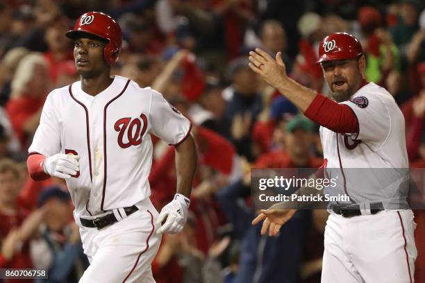 Michael A. Taylor of the Washington Nationals celebrates with Bob Henley of the Washington Nationals after hitting a three run home run against the...