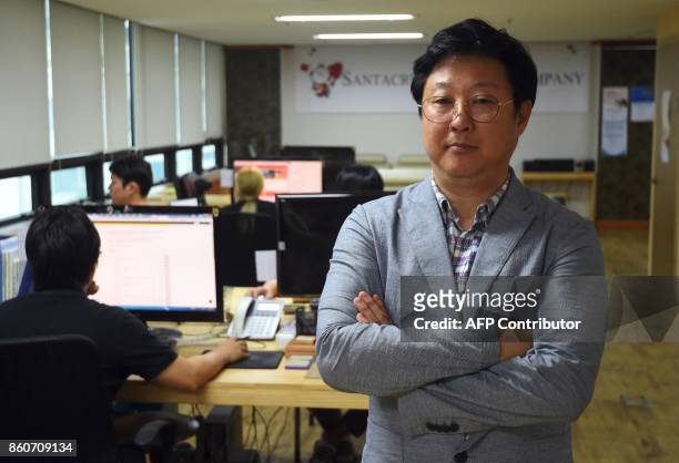 This picture taken on July 24, 2017 shows Kim Ho-Jin, CEO of Santa Cruise "digital laundry" company, posing at his office in Seoul. The company is...