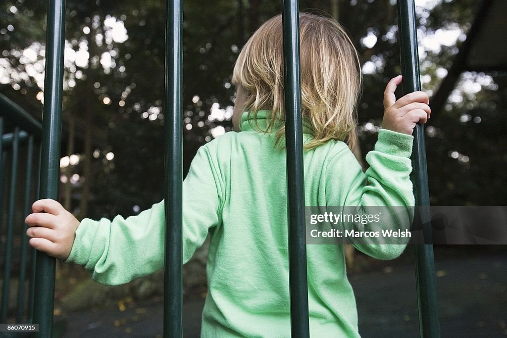 Child by bars