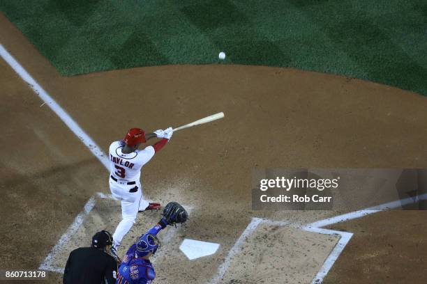 Michael A. Taylor of the Washington Nationals hits a three run home run against the Chicago Cubs during the second inning in game five of the...