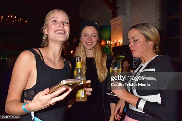 Kim Hnidzo, Nina Hnizdo and Marina Hoermanseder attend the Amorelie Christmas Calender Launch Dinner on October 12, 2017 in Berlin, Germany.