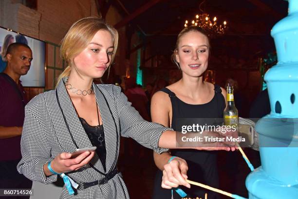 Julia Wulf and Kim Hnizdo attend the Amorelie Christmas Calender Launch Dinner on October 12, 2017 in Berlin, Germany.
