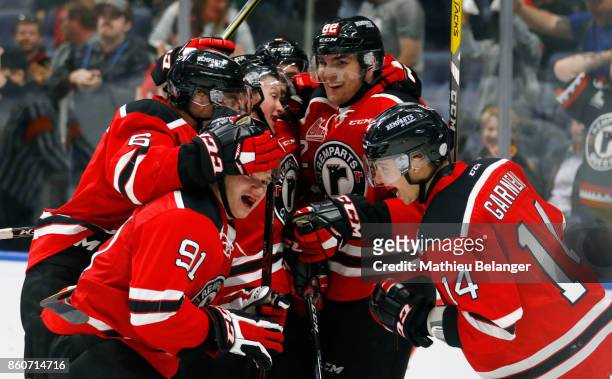 Olivier Garneau of the Quebec Remparts celebrates his game tying goal with his teammates against the Victoriaville Tigres during the third period of...
