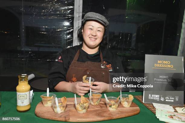 Vendor from Momo Premium Tofu serves food at The Food Network & Cooking Channel New York City Wine & Food Festival Presented By Coca-Cola -...