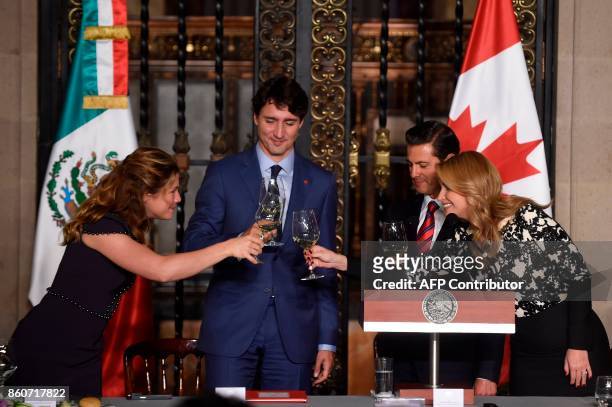 Canada's Prime Minister Justin Trudeau his wife Sophie Gregoire , Mexican President Enrique Pena Nieto and his wife Angelica Rivera, make a toast...